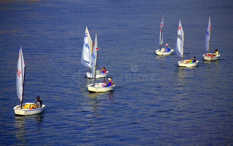Kids sailing boats royalty free stock photo Kids sailing boats royalty free stock photo
