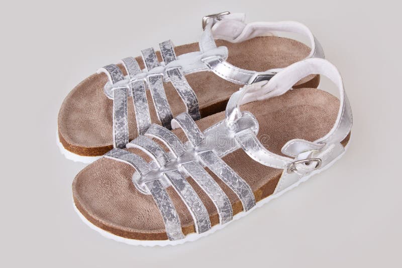 Kids silver sandals isolated on white background stock images Kids silver sandals isolated on white background stock images