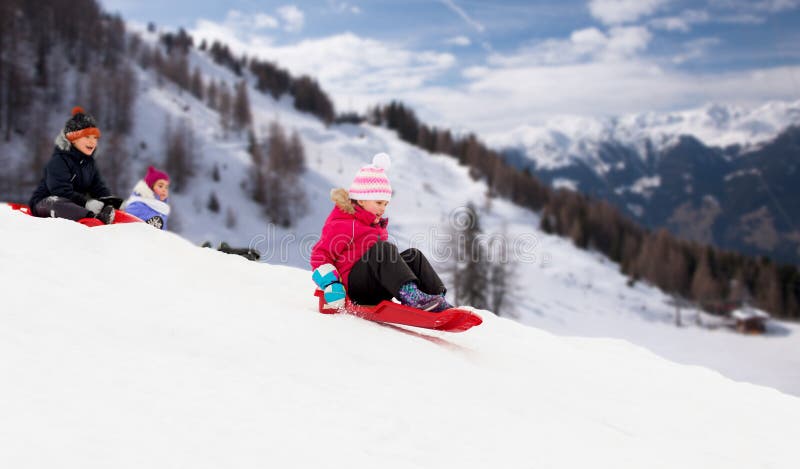 Kids Sliding on Sleds Down Snow Hill in Winter Stock Photo - Image of sled,  cute: 236271082