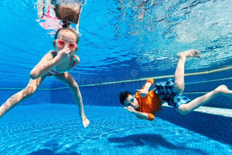 Kids swimming underwater royalty free stock photo Kids swimming underwater royalty free stock photo