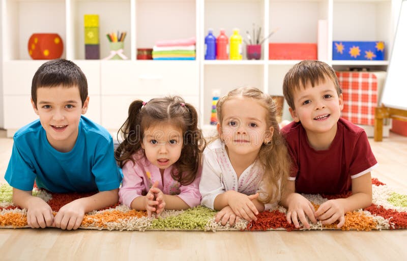 Kids in their room ready for their closeup - posing laying on the floor