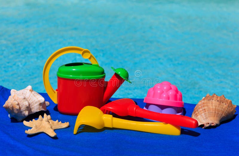 Kids toys at the swimming pool stock photos