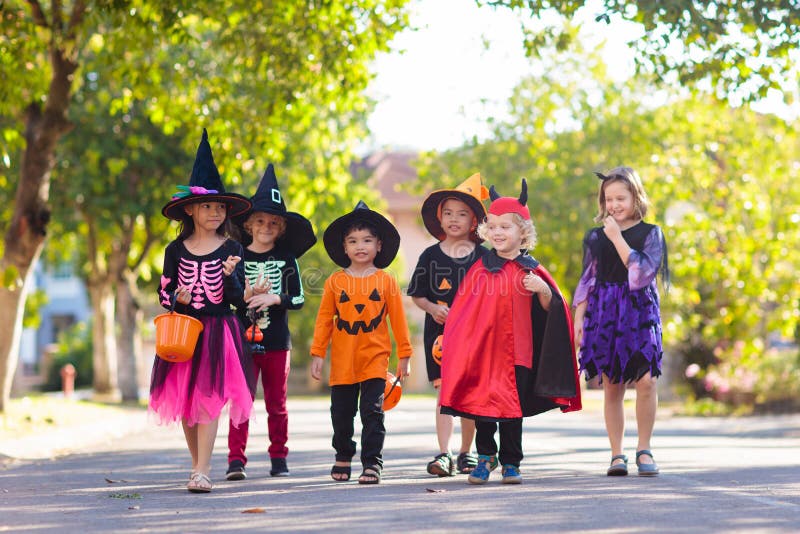 Kids Trick Or Treat. Halloween In Face Mask Stock Photo - Image of ...