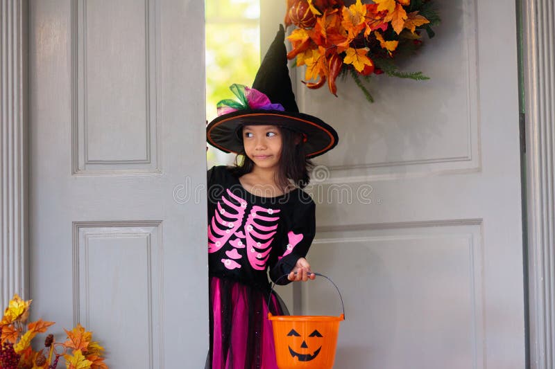 Kids trick or treat. Halloween. Child at door