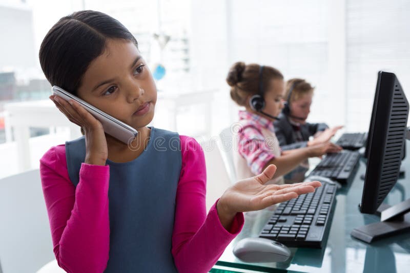 Kids Using Computer in Office Stock Photo - Image of expertise