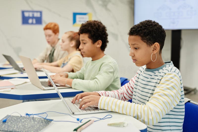 Kids Using Laptops in Row royalty free stock images