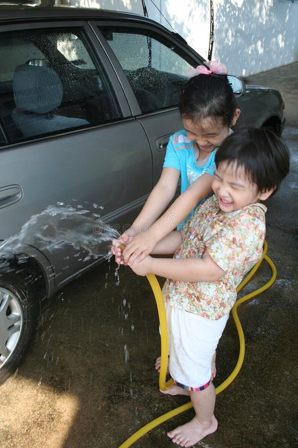 Kids Helping Clean Car stock photo. Image of people, candid - 92109982