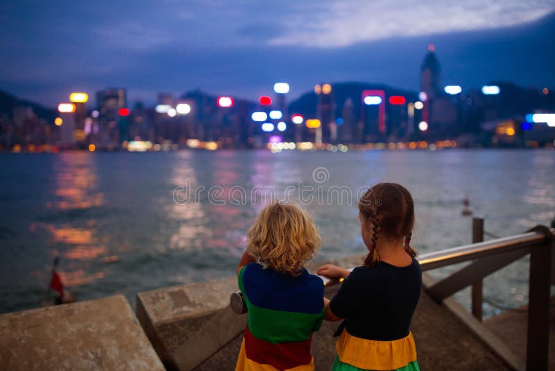 Kids watch Hong Kong harbor skyline royalty free stock photo Kids watch Hong Kong harbor skyline royalty free stock photo
