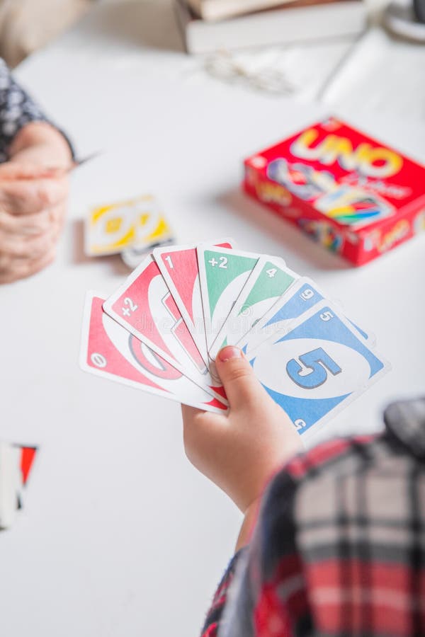 Uno cards in hand, card game Stock Photo by ©Egor_1896 239236398