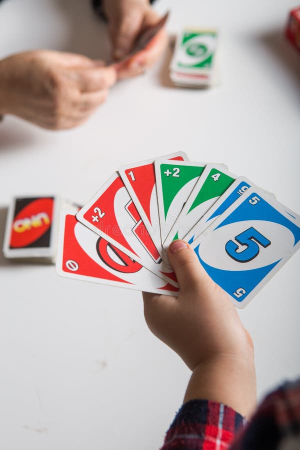 Uno cards in hand, card game Stock Photo by ©Egor_1896 239236398