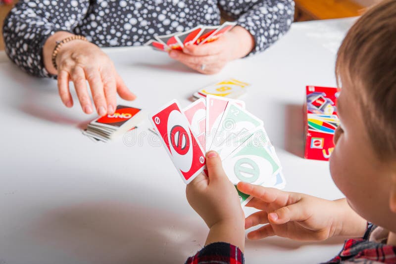 Uno cards in hand, card game Stock Photo by ©Egor_1896 239236398