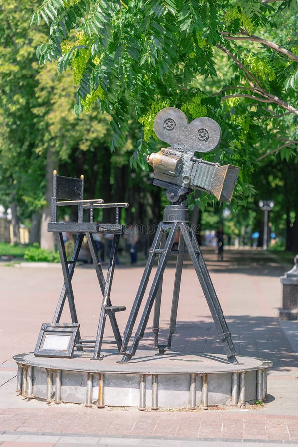 Kiev, Ukraine - July 20, 2019: Monument of Movie Camera and Cameraman Cinema Director Chair royalty free stock photography Kiev, Ukraine - July 20, 2019: Monument of Movie Camera and Cameraman Cinema Director Chair royalty free stock photography