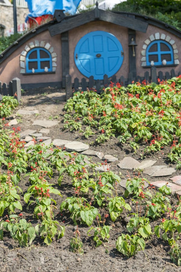 Kiev, Ukraine. Juny 20 2019 The little hobbit house. Themed flowerbed in the park. vertical photo stock image Kiev, Ukraine. Juny 20 2019 The little hobbit house. Themed flowerbed in the park. vertical photo stock image
