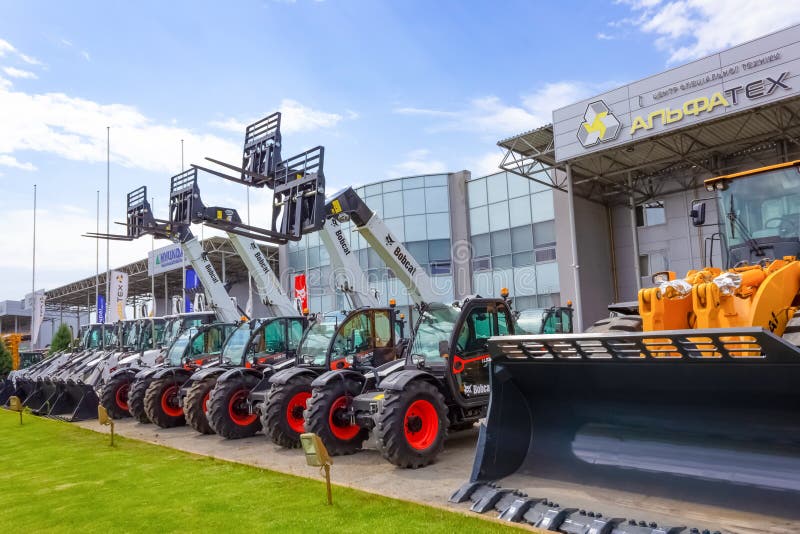 Kyiv, Ukraine - June 16, 2020: Skid steer loader Bobcat at road at Kyiv, Ukraine on June 16, 2020. Kyiv, Ukraine - June 16, 2020: Skid steer loader Bobcat at road at Kyiv, Ukraine on June 16, 2020