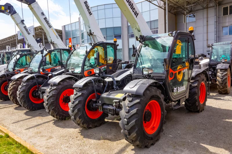 Kyiv, Ukraine - June 16, 2020: Skid steer loader Bobcat at road at Kyiv, Ukraine on June 16, 2020. Kyiv, Ukraine - June 16, 2020: Skid steer loader Bobcat at road at Kyiv, Ukraine on June 16, 2020