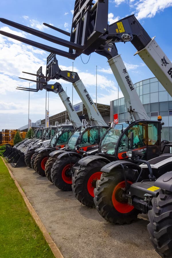 Kyiv, Ukraine - June 16, 2020: Skid steer loader Bobcat at road at Kyiv, Ukraine on June 16, 2020. Kyiv, Ukraine - June 16, 2020: Skid steer loader Bobcat at road at Kyiv, Ukraine on June 16, 2020