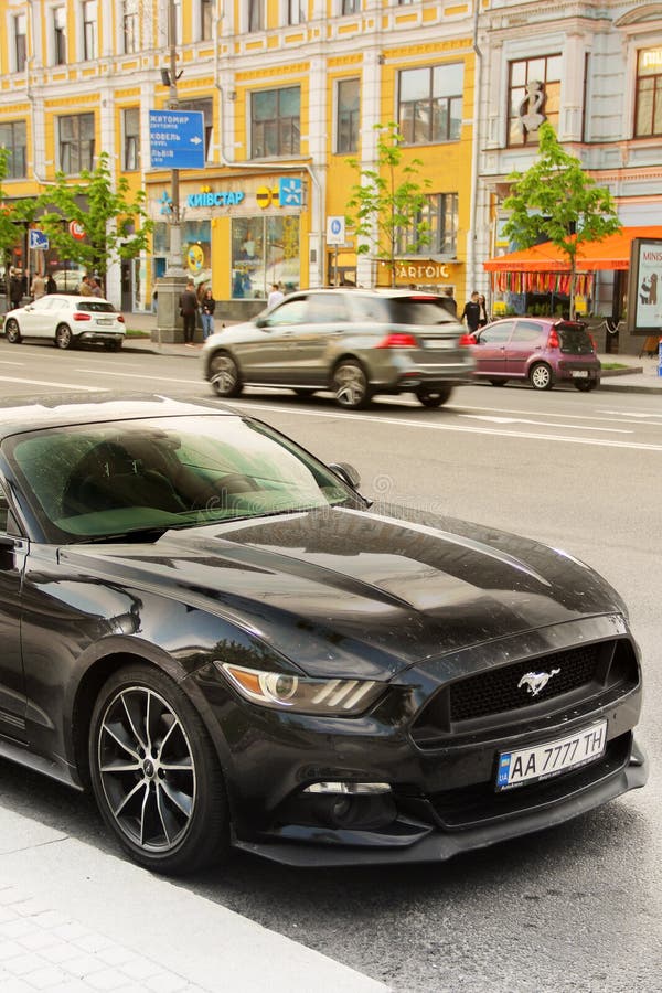 Kiev, Ukraine - May 3, 2019: Black Ford Mustang in the city stock image Kiev, Ukraine - May 3, 2019: Black Ford Mustang in the city stock image