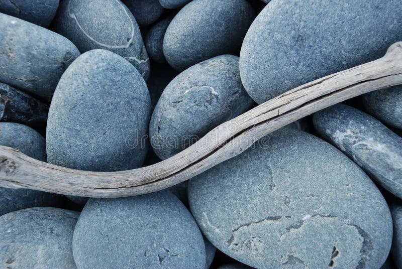 Pebbles and Driftwood on a beach. Pebbles and Driftwood on a beach