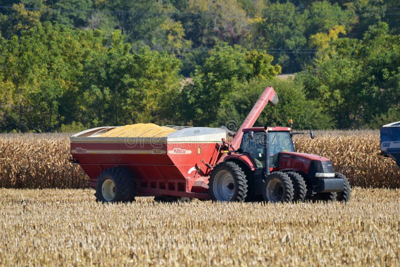 Killbros grain wagon loaded with corn being pulled by a Case 305 tractor