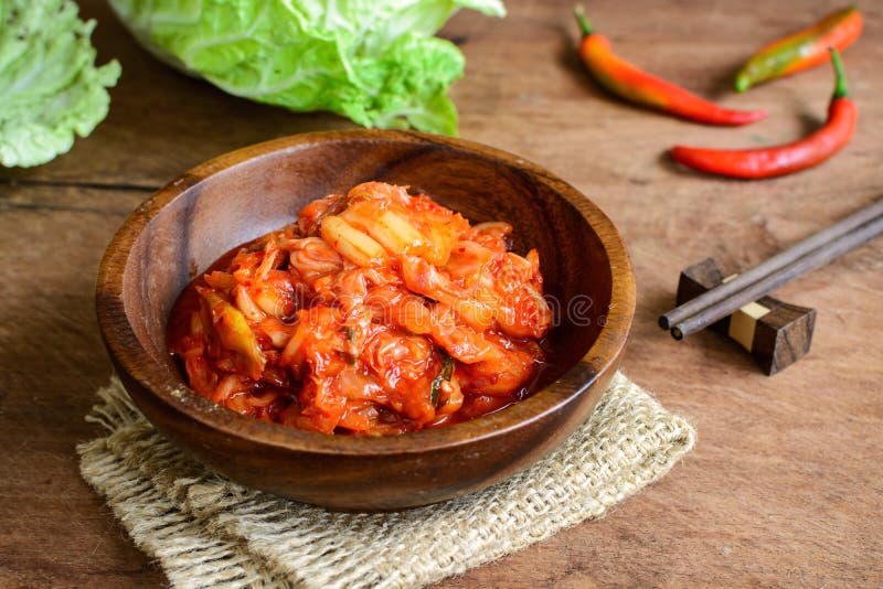 Kimchi with Chopsticks on wooden table, korean food