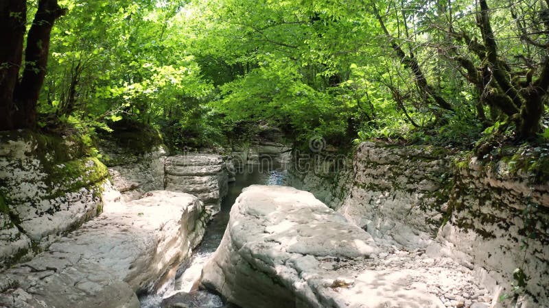 The Kinchkha waterfall in the canyon of the river Okatse. Rest in Georgia. High waterfall in the Imereti region. Rocky ledges of t