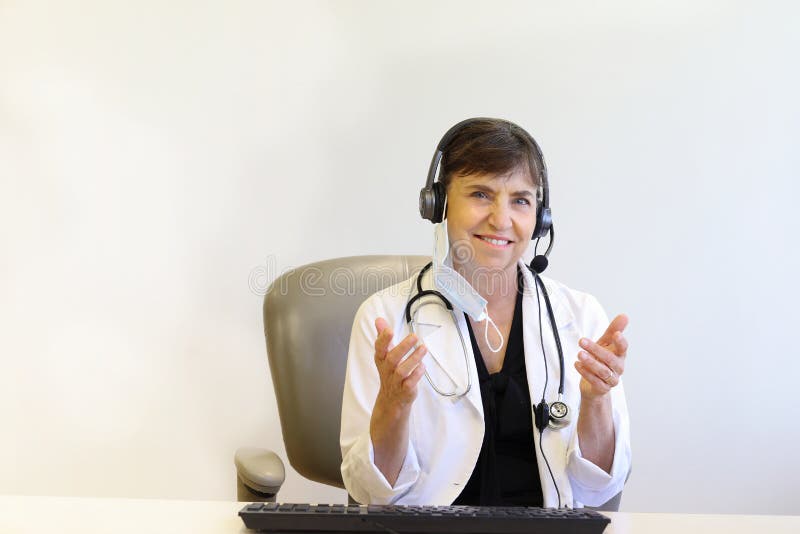 Kind doctor explaining during telemedicine online session royalty free stock photography