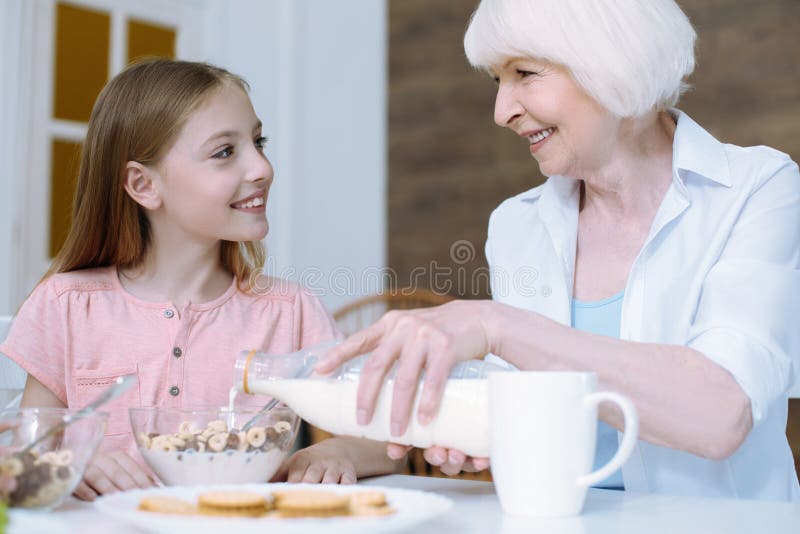 Kind girl looking softly at her granny