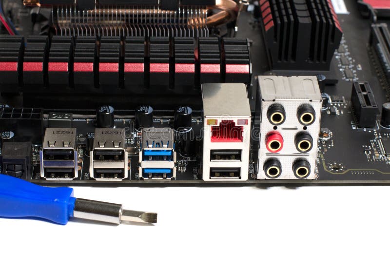 Kind of Motherboard on the Side with Tools and Parts for Repair Stock