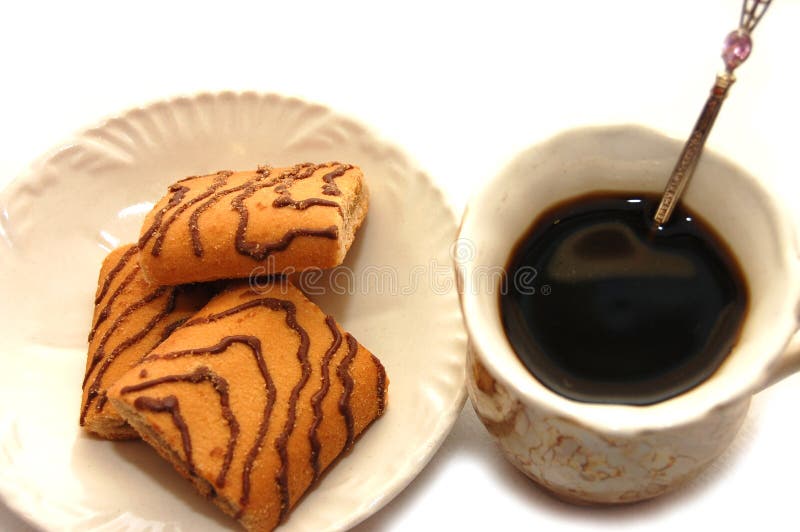 Kind with top cup coffee and plate with cookies