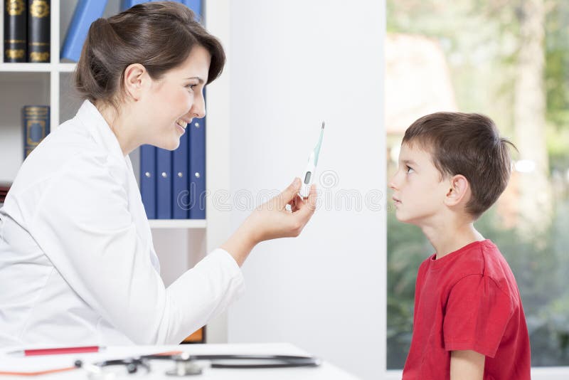 Pediatrician holding thermometer to take temperature of patient. Pediatrician holding thermometer to take temperature of patient