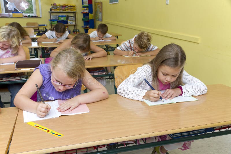 Children in a yellow classroom. They are learning together. Children in a yellow classroom. They are learning together.