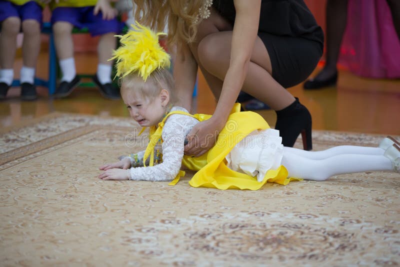 Kindergarten for children. Children`s holiday.The little child fell