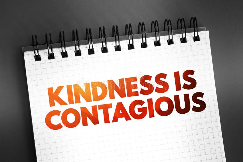 Kindness Is Contagious text quote on notepad, concept background royalty free stock photography