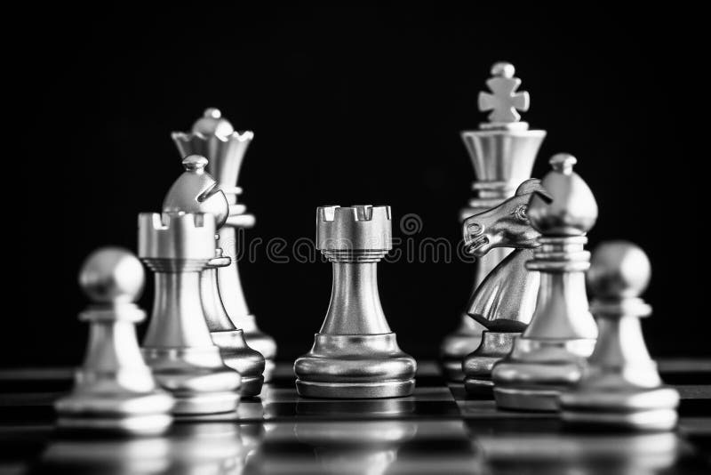 Chess game on chess board behind business man background. Business concept  to present financial information and marketing strategy analysis. Investmen  Stock Photo - Alamy