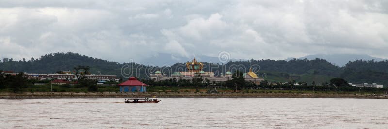 Golden Triangle Special Economic Zone, Laos - August 04 2012: The Kings Romans Casino on the bank of the Mekong River. It is built on the 10,000 hectares of the Golden Triangle Special Economic Zone, a 99-year lease made from the Laotian government to the Chinese-owned Kings Romans Group. Golden Triangle Special Economic Zone, Laos - August 04 2012: The Kings Romans Casino on the bank of the Mekong River. It is built on the 10,000 hectares of the Golden Triangle Special Economic Zone, a 99-year lease made from the Laotian government to the Chinese-owned Kings Romans Group