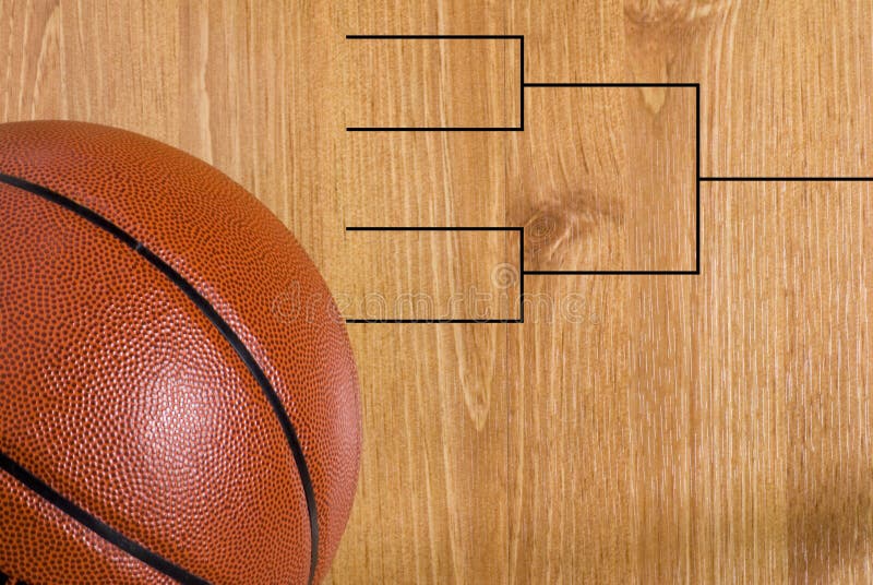 A final four bracket on a basketball floor and a ball. A final four bracket on a basketball floor and a ball