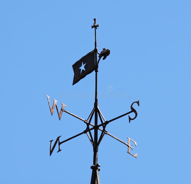 Church weathervain against a clear blue sky. Church weathervain against a clear blue sky