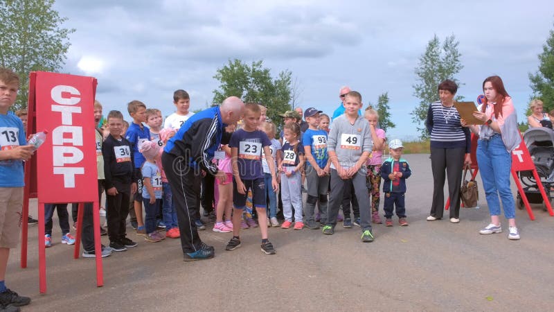 Kirov, Russia, 17-08-2019: Children running competitions in city, start jogging.