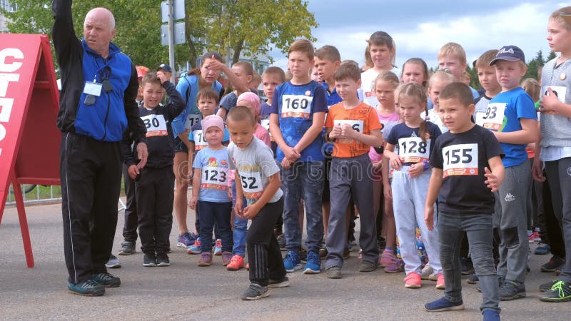 Kirov, Russia, 17-08-2019: Children running competitions in city, start jogging.