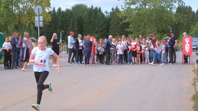 Kirov, Russia, 17-08-2019: Children running competitions in city, start jogging.