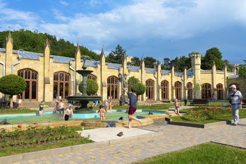 Kislovodsk, Russia - July, 2017: The building of the Narzan gallery. Children playing in fountain.The city centre of Kislovodsk. royalty free stock images Kislovodsk, Russia - July, 2017: The building of the Narzan gallery. Children playing in fountain.The city centre of Kislovodsk. royalty free stock images