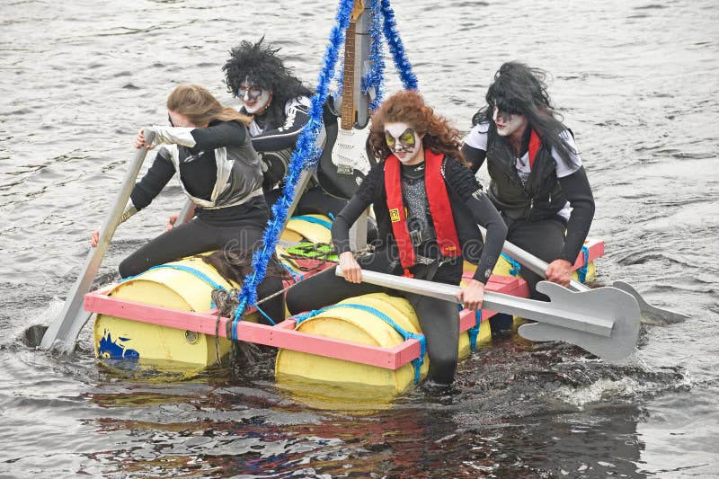 Kiss look-a-likes in raft race.