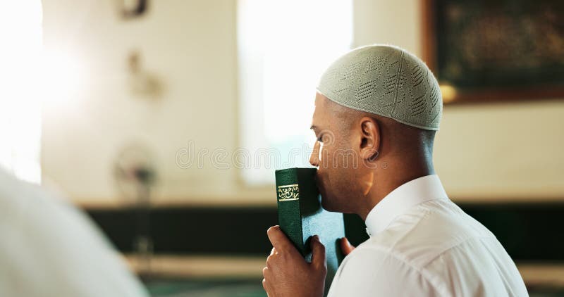 Kiss, man and Quran in mosque for Muslim faith, studying and spiritual help for worship or praise Allah. Islamic, love royalty free stock photo