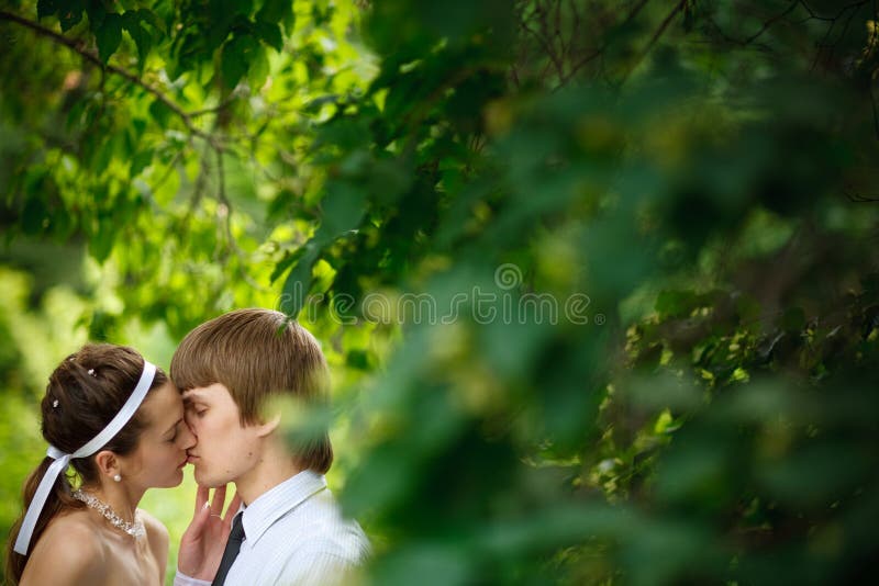 Kiss near the tree