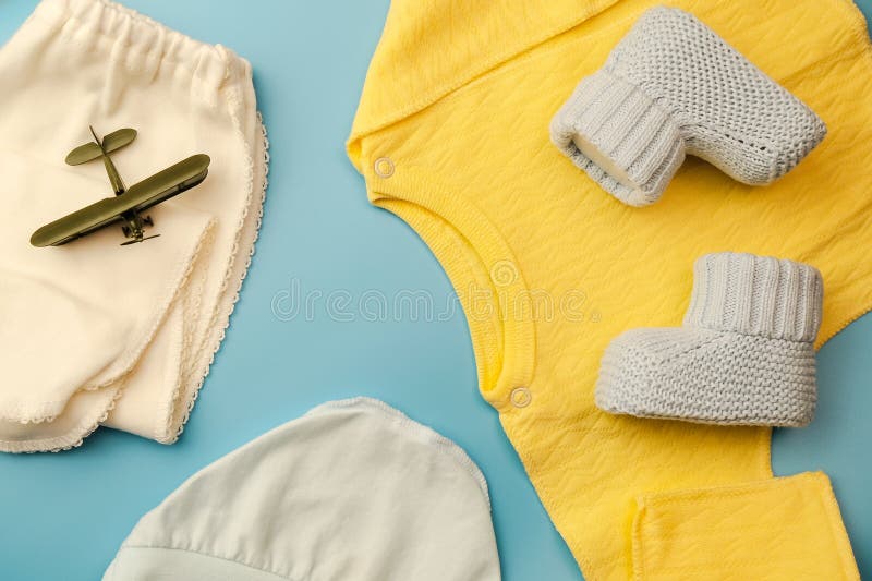 Kit of clothes for a newborn baby boy. Flatlay design. royalty free stock photos