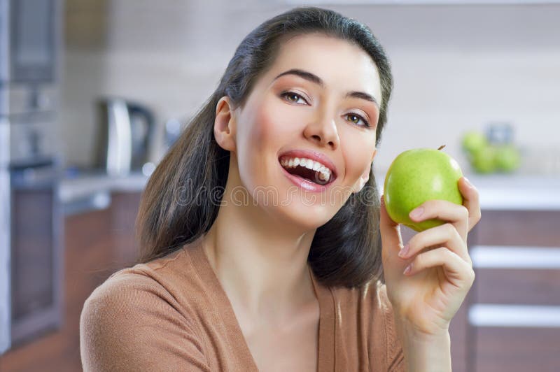 Woman Eating Granny Smith Apple on Sofa Stock Photo Image of food, horizontal 32278428