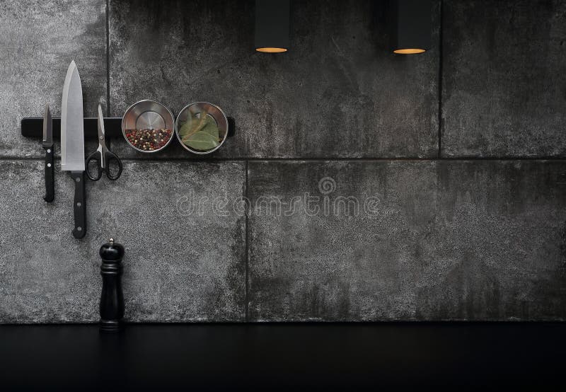 Kitchen Accessories Mounted on the Black Stone Wall Stock Photo Image