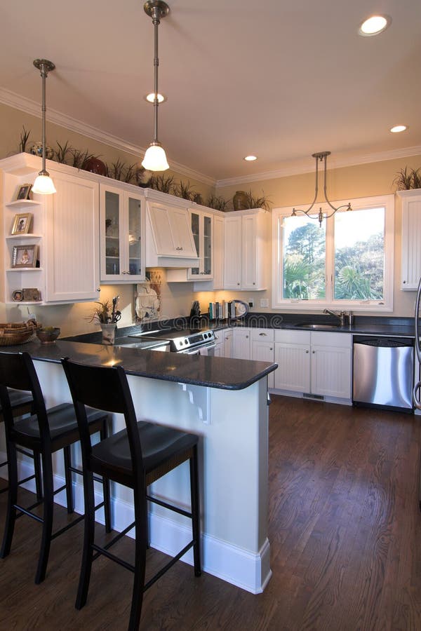 building a kitchen bar Love the built-in bar seating next to the ...