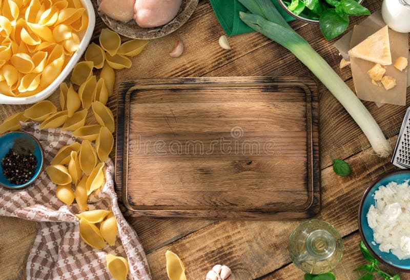 Kitchen Board with Ingredients for Cooking Pasta on Wooden Table Stock ...