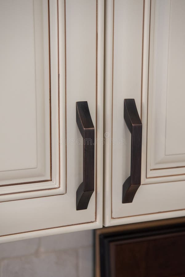 Kitchen cabinet handles stock image. Image of close - 320468123